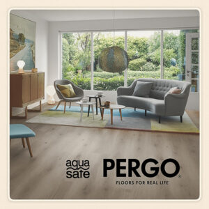 Modern living room featuring Pergo Mandal Aqua Safe light grey laminate flooring with mid-century furniture and natural light