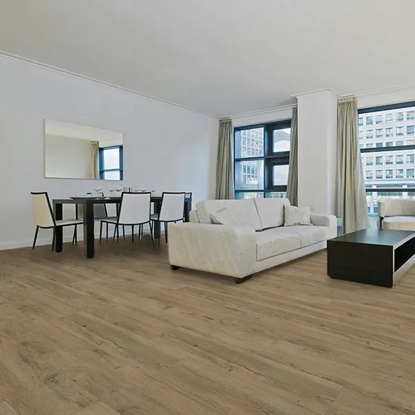 Living and dining area with DeZign 540 vinyl flooring in Authentic Oak – modern interior with warm wood finish